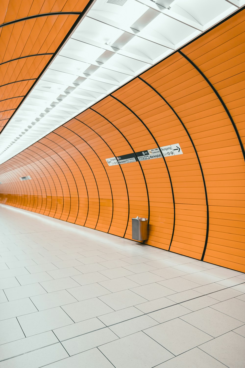 white and orange tiled hallway