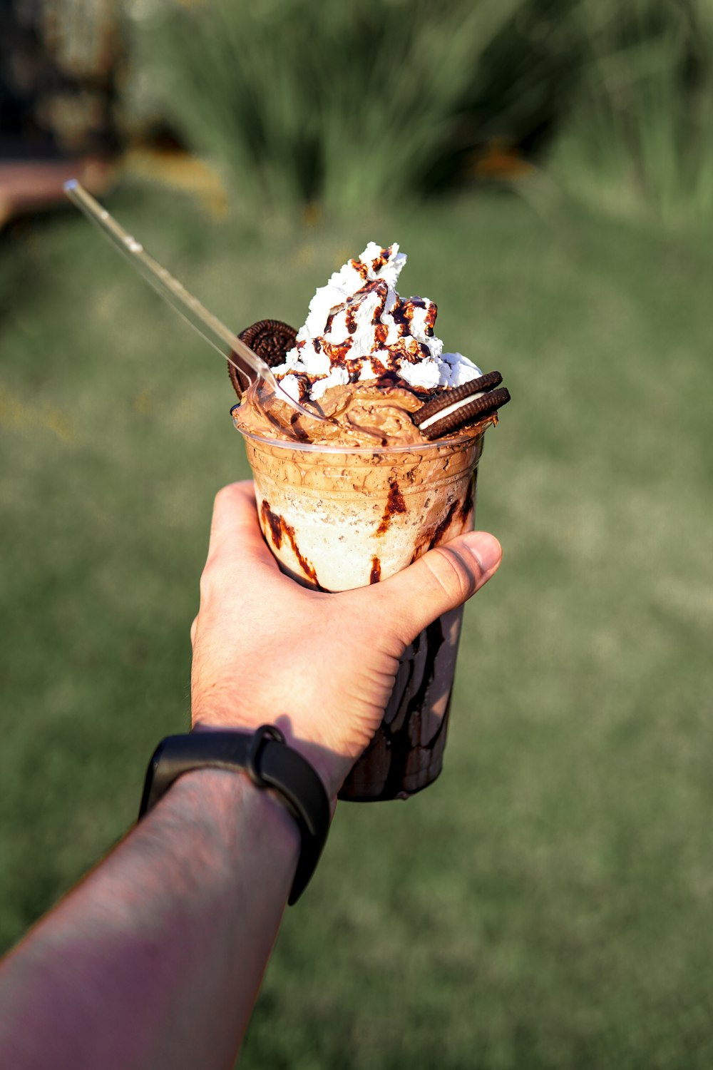 person holding ice cream cup