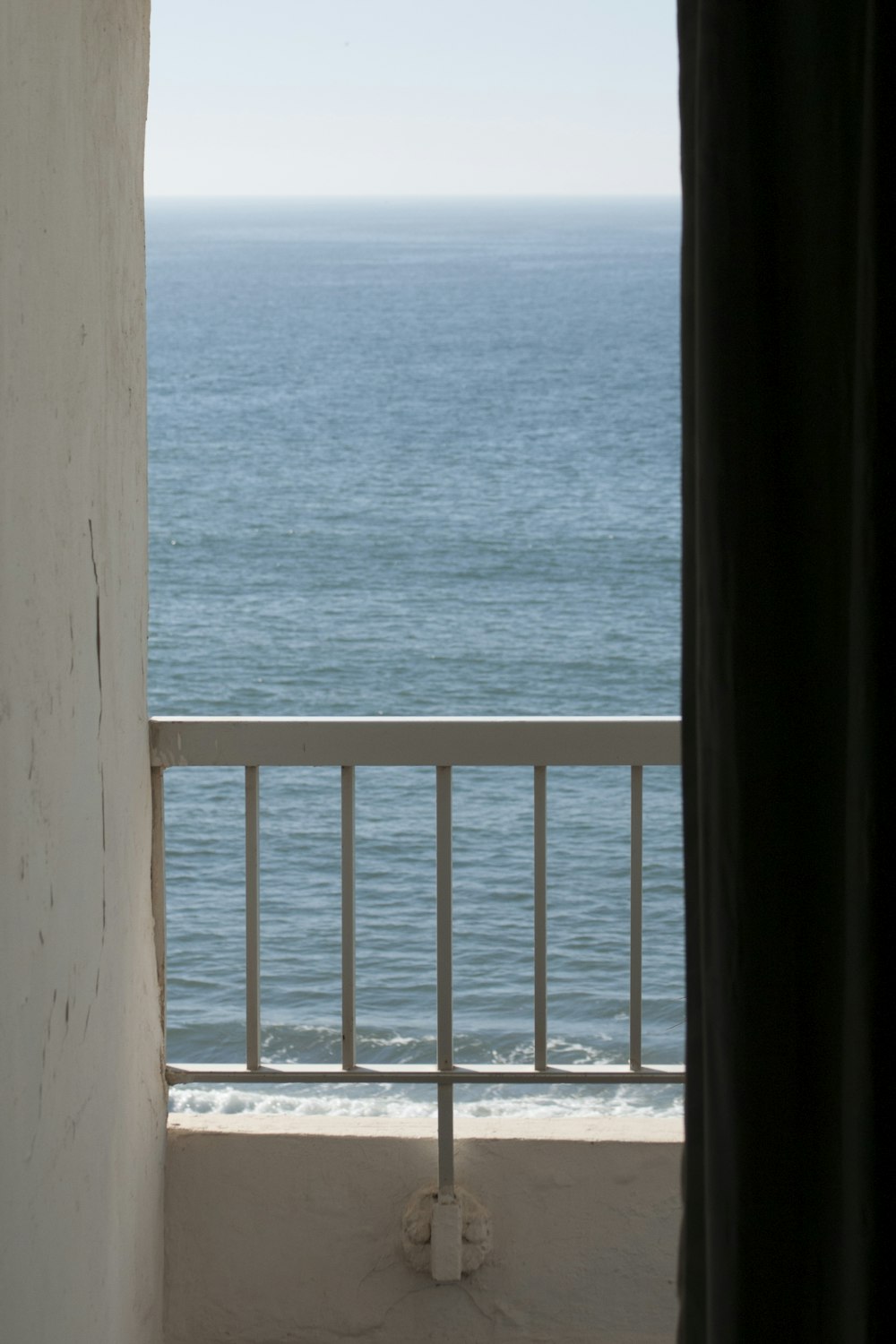 a view of the ocean from a balcony