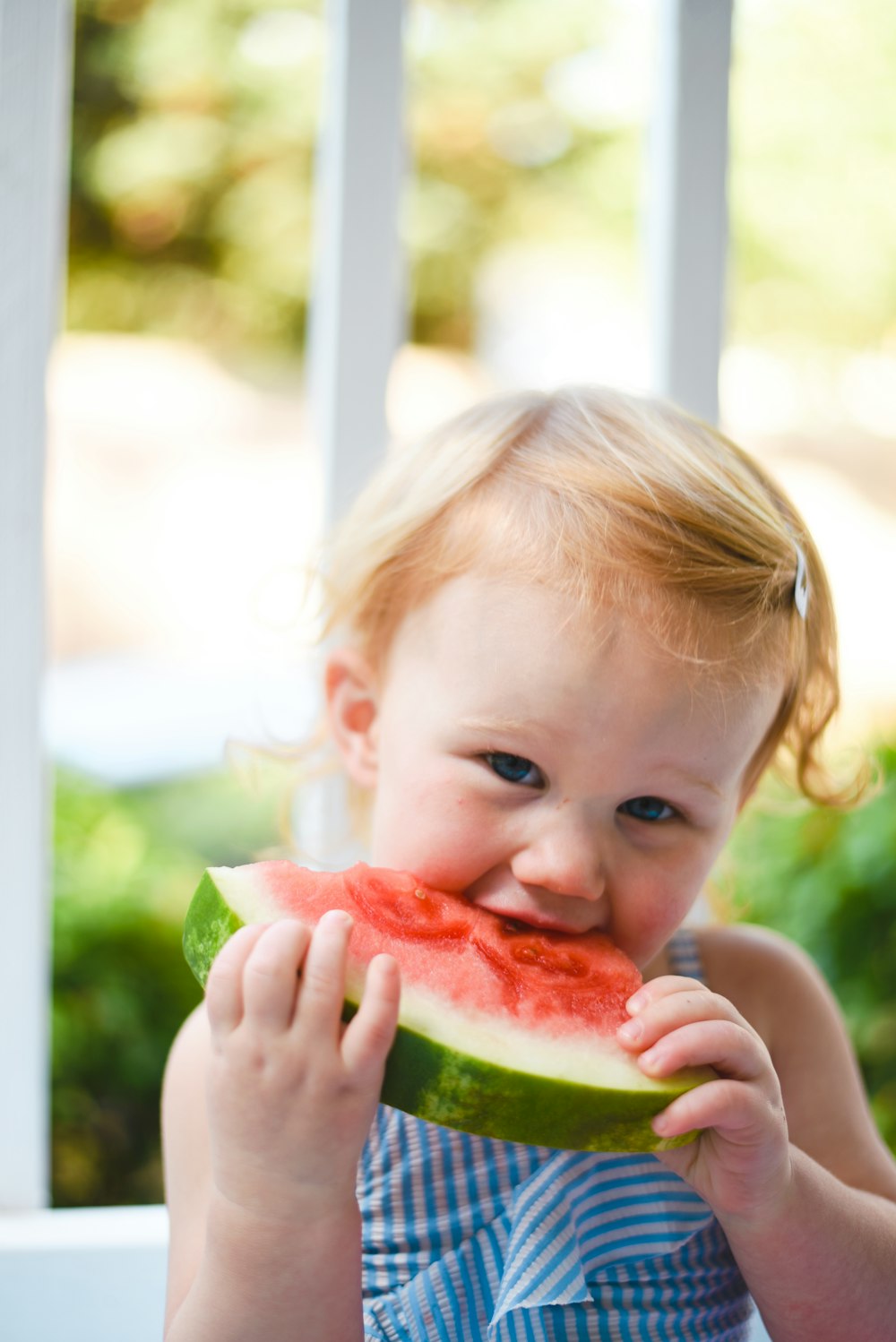 girl eating watermelon close-up photography