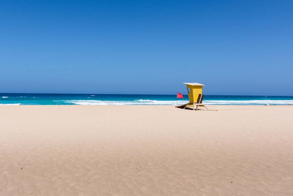 yellow wooden lifeguard stall