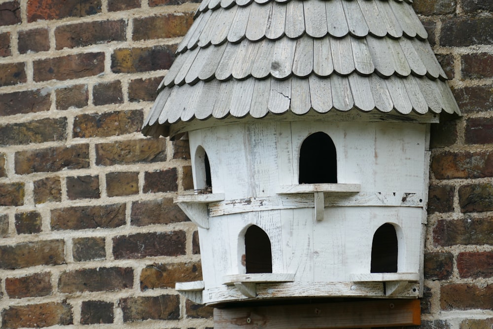 white wooden house bird house