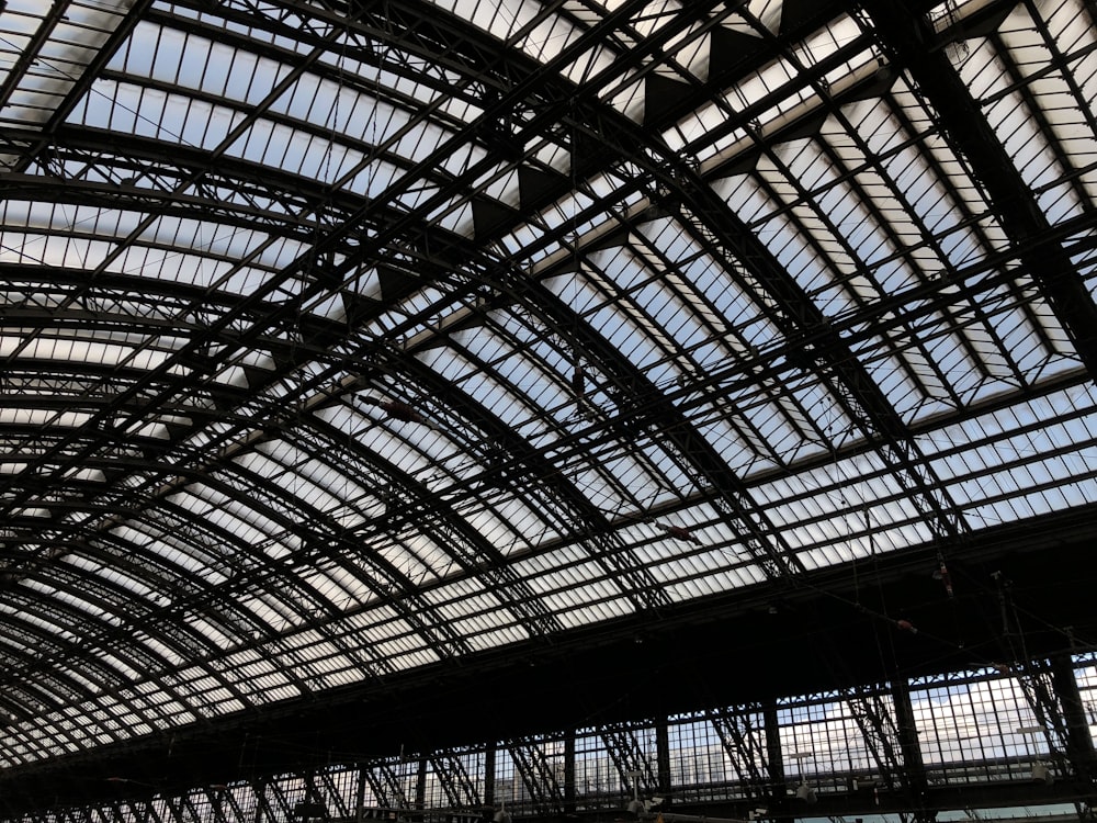 the ceiling of a train station with many windows