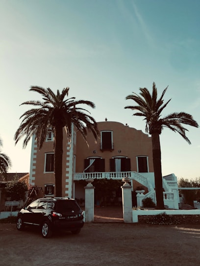 A freshly renovated villa exterior showcasing modern design and pristine finishes under Abu Dhabi sunlight.