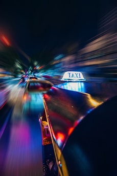 yellow taxi time lapse photography