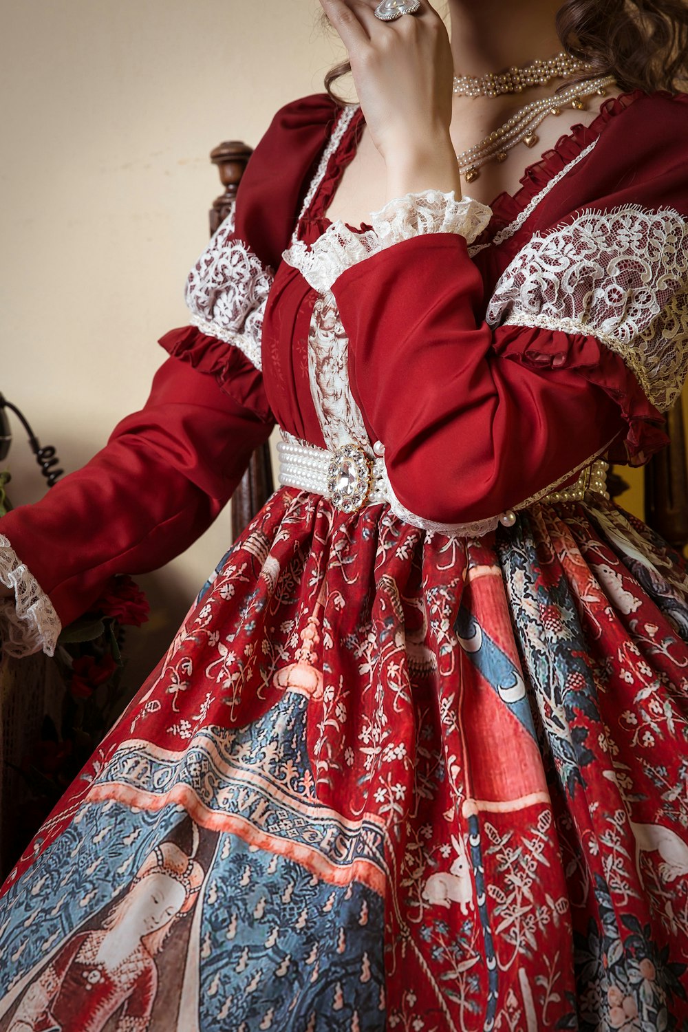 woman wearing red and multicolored floral dress