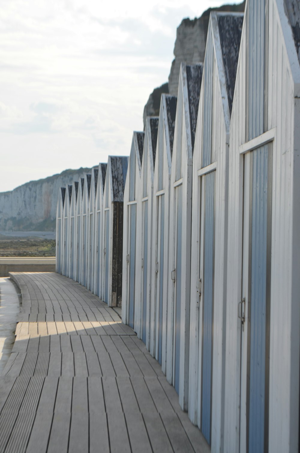 blue-and-white wooden sheds