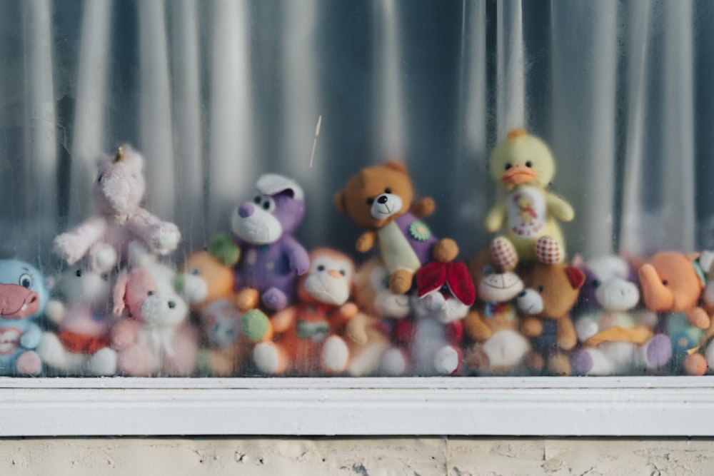 assorted plushies by the window