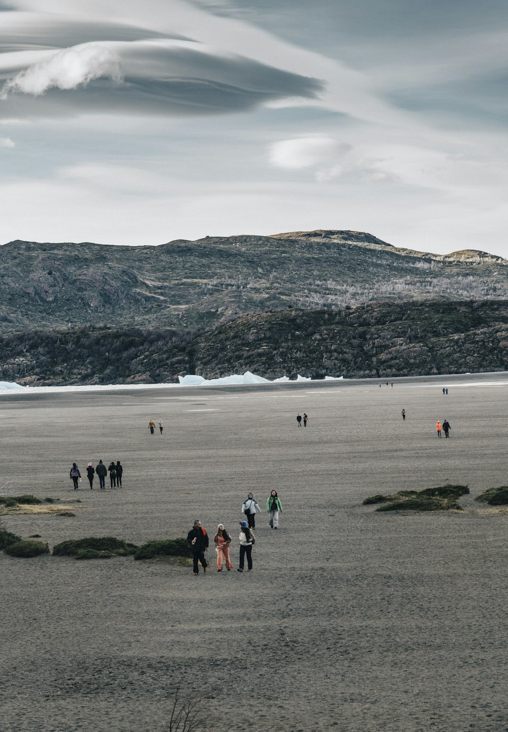 people walking on sand