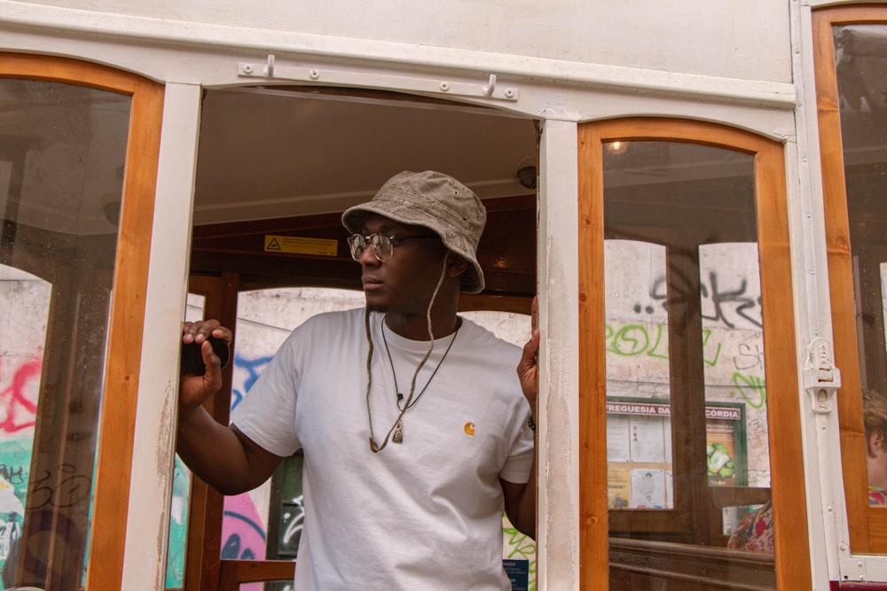 a man wearing a hat and listening to music