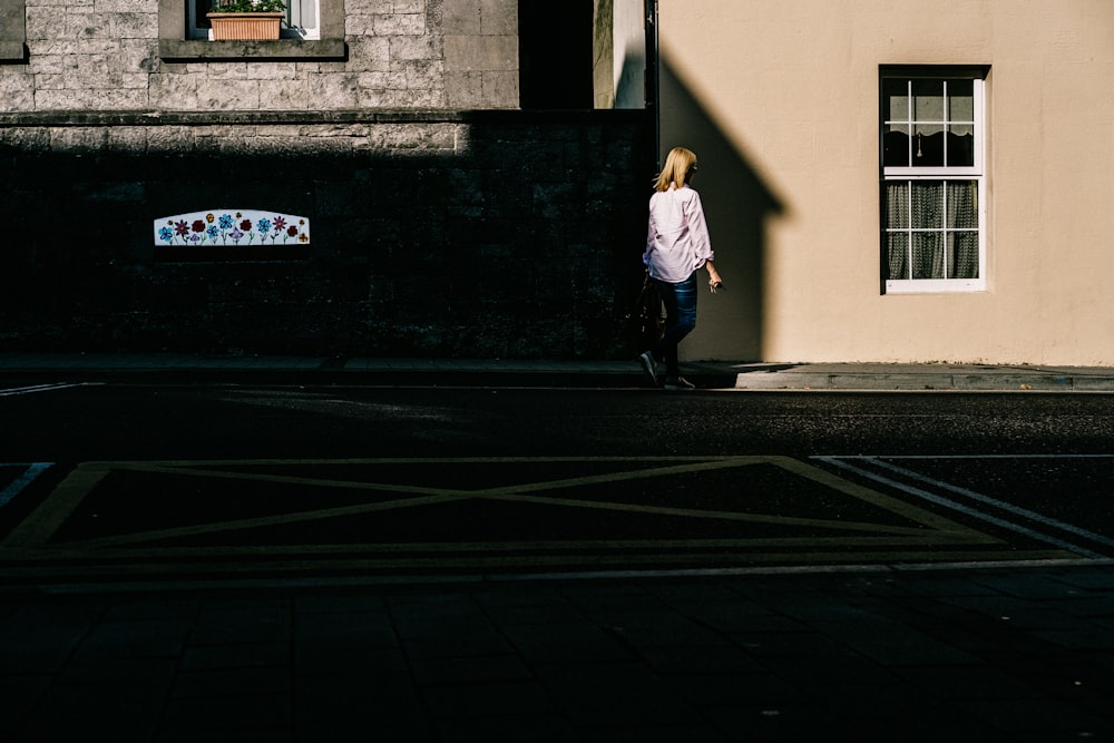 woman walking on sidewalk