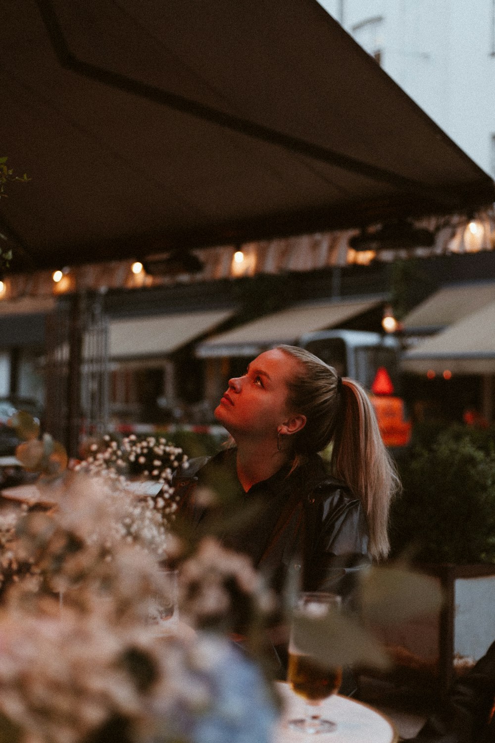 woman looking up on parasol