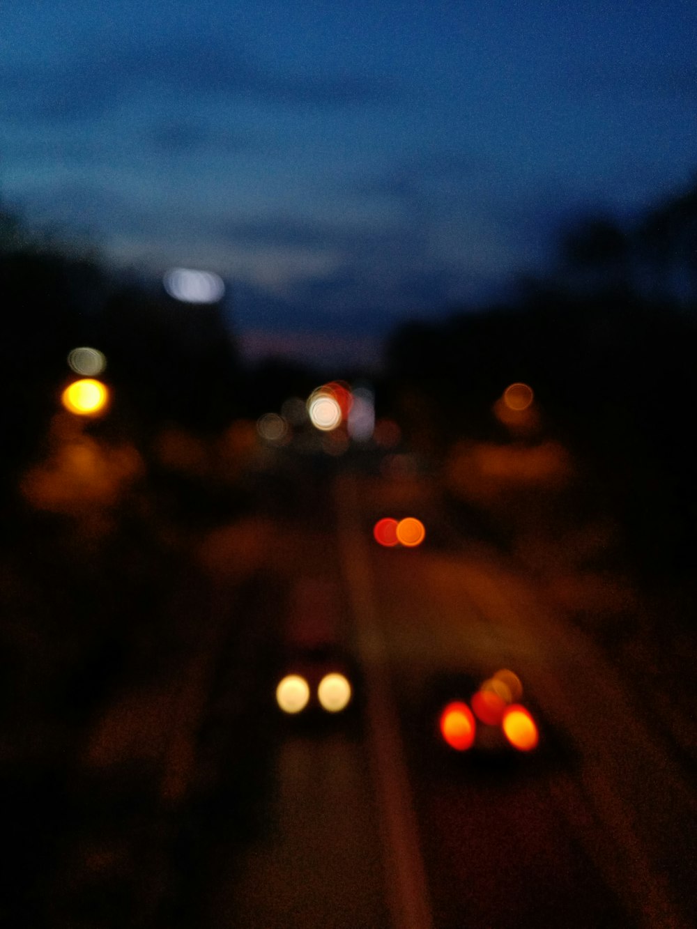 a blurry photo of a highway at night