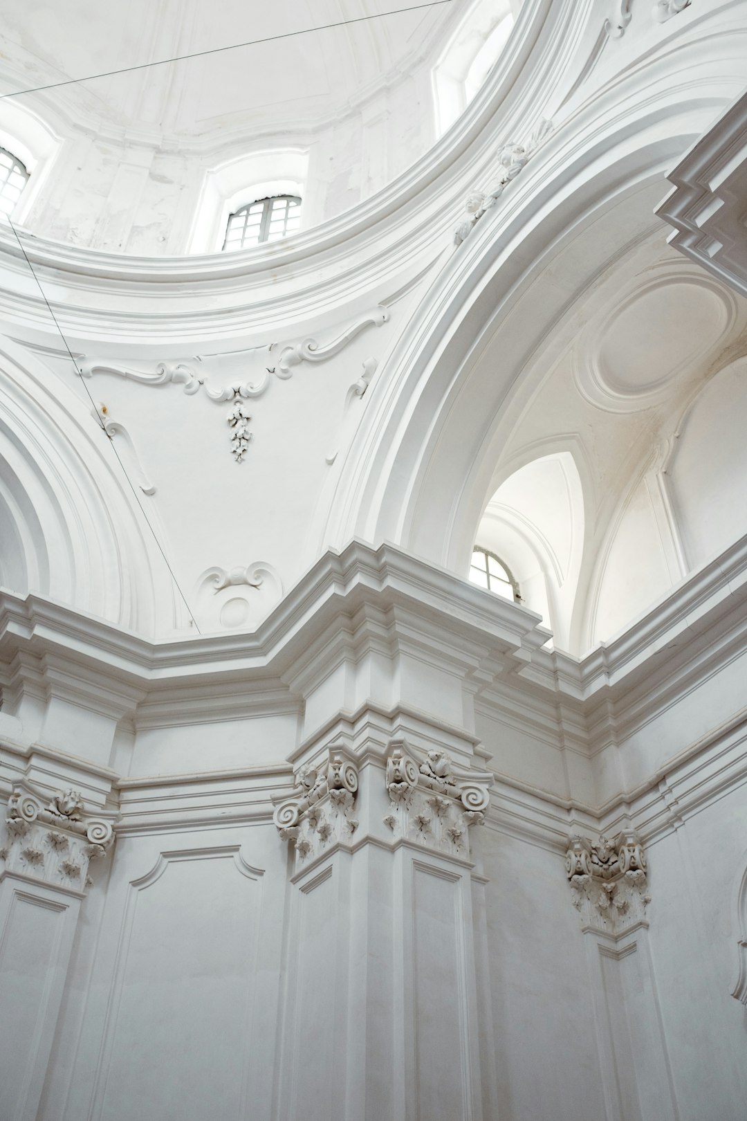 white painted concrete pillar and roof