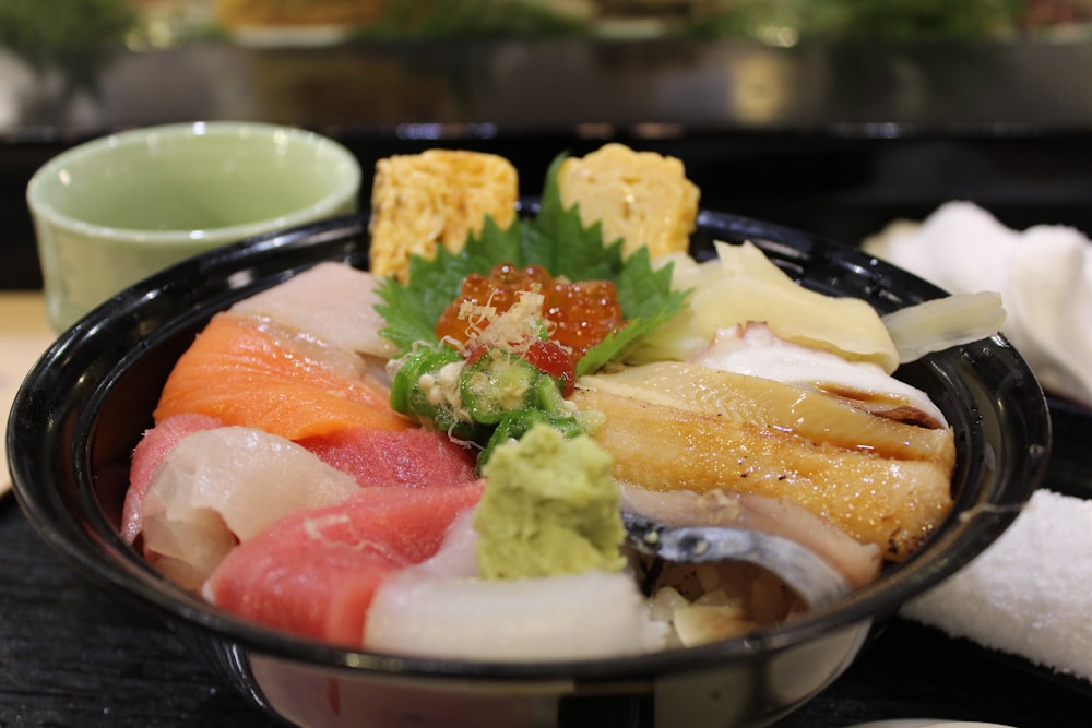 raw meat in black bowl