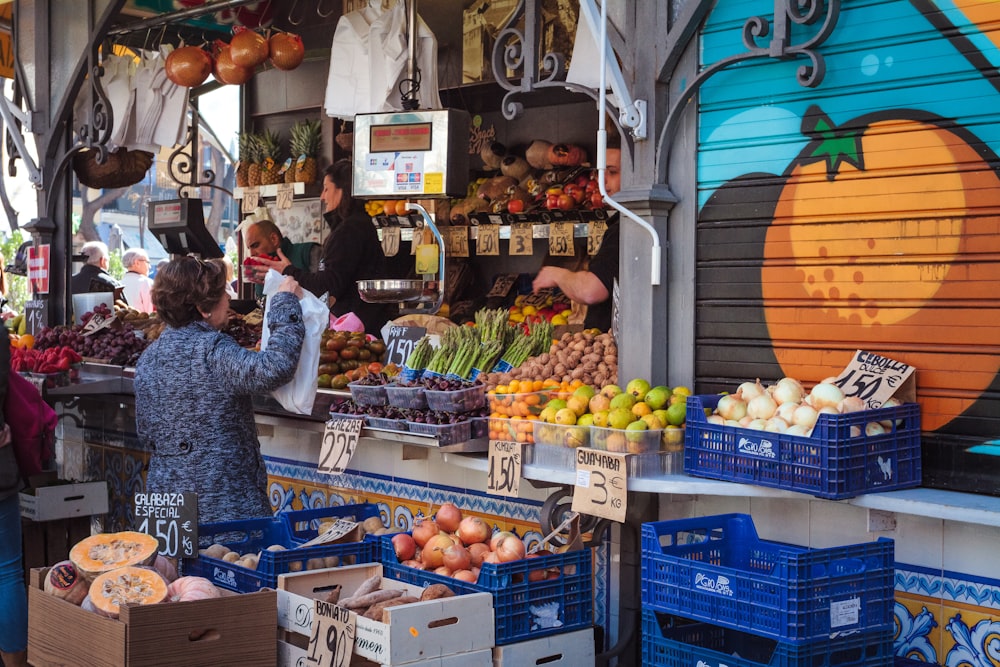 woman standing on market during daytime