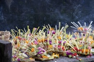 Close-up of a strong offering bowl filled with herbs and flowers dedicated to Mãe Oxum.