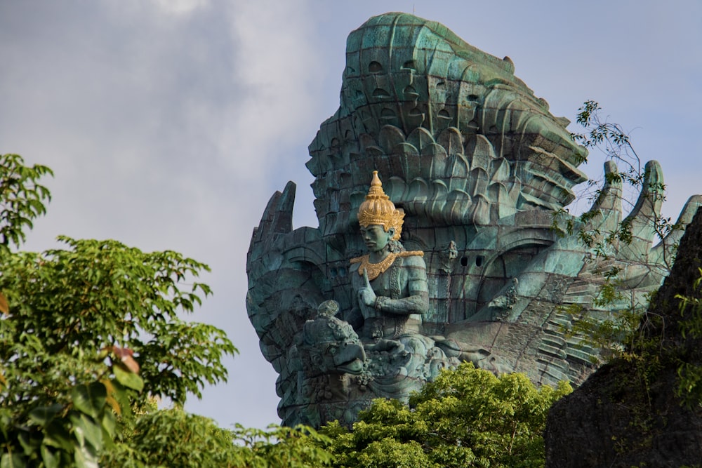 Buddha statues near trees