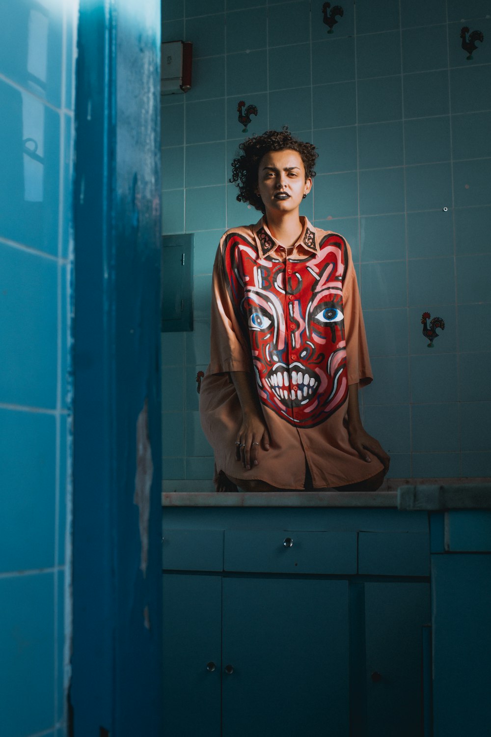 woman wears orange and red dress