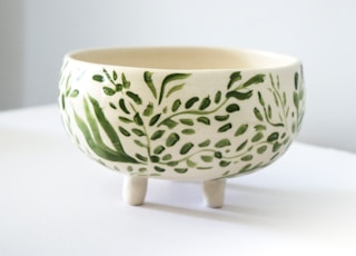 footed white and green floral bowl