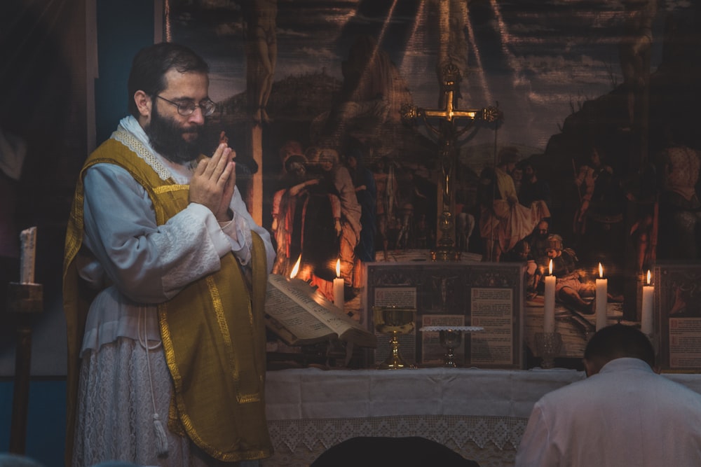 man standing and praying