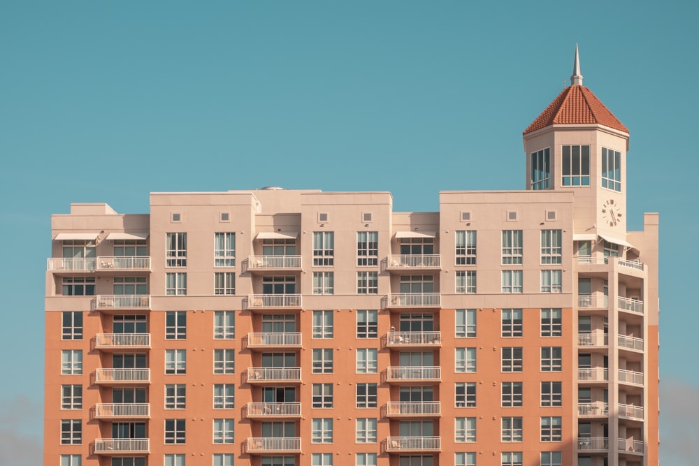 orange and white concrete building at daytime