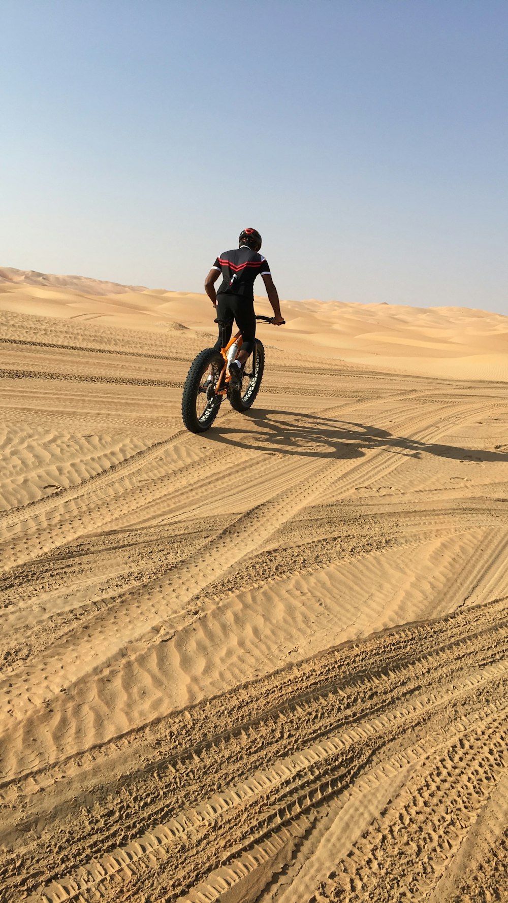 man on fatbike in desert