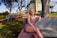 laughing woman sitting on bench