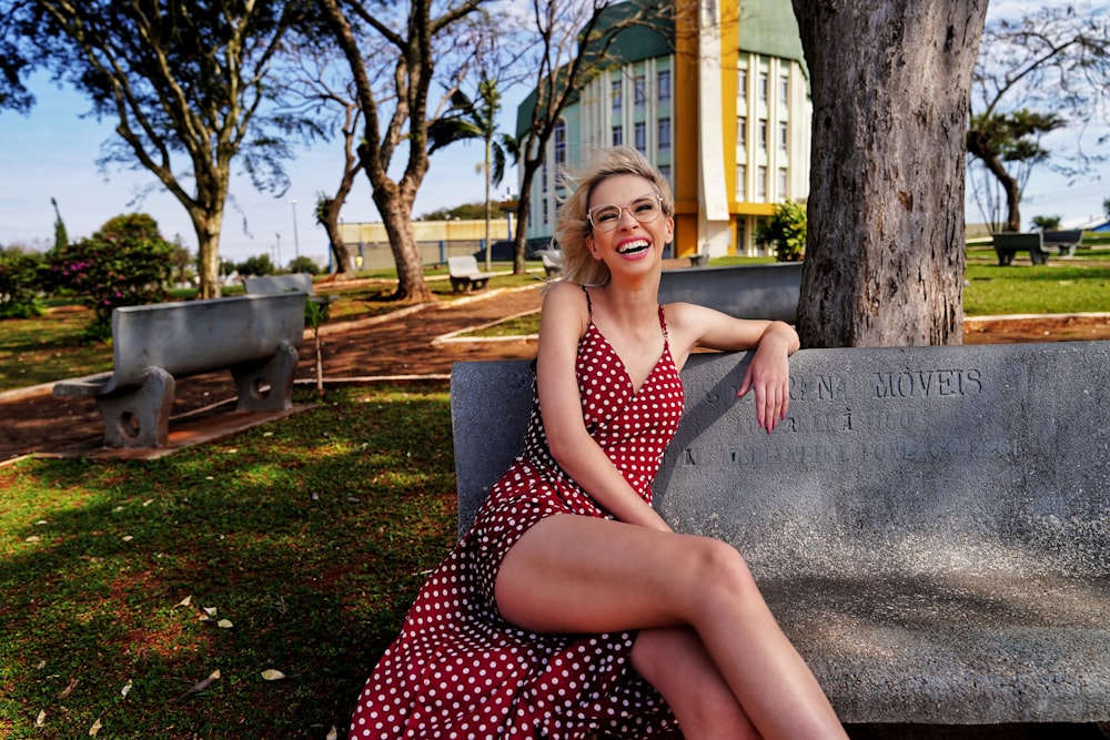 laughing woman sitting on bench