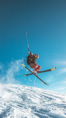 Skiers on a snowy mountain slope