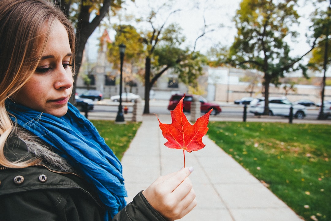 woman holding maple leaf