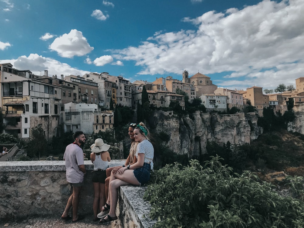 women sitting on block