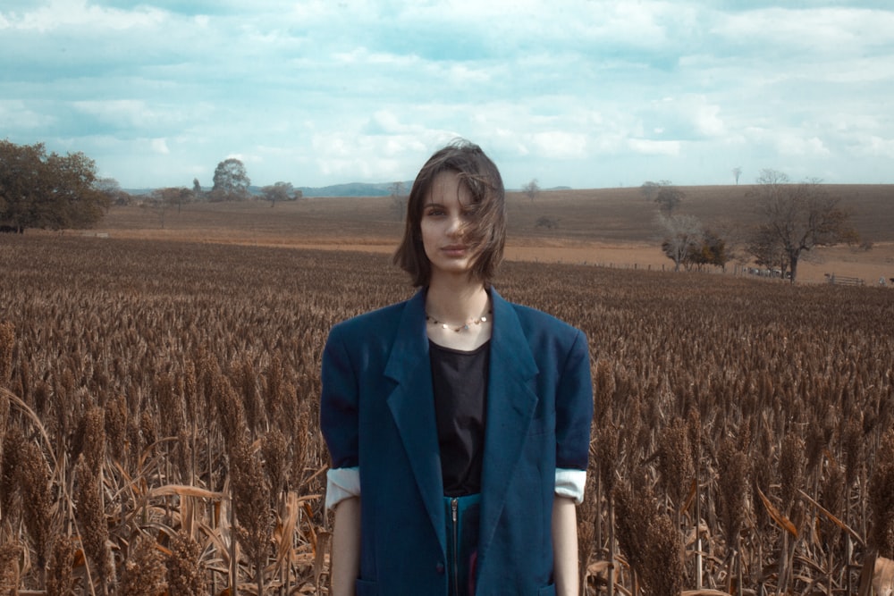 woman stands near field