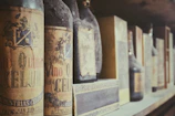 A sommelier presenting vintage wines paired with historical menus.
