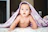 baby under purple blanket