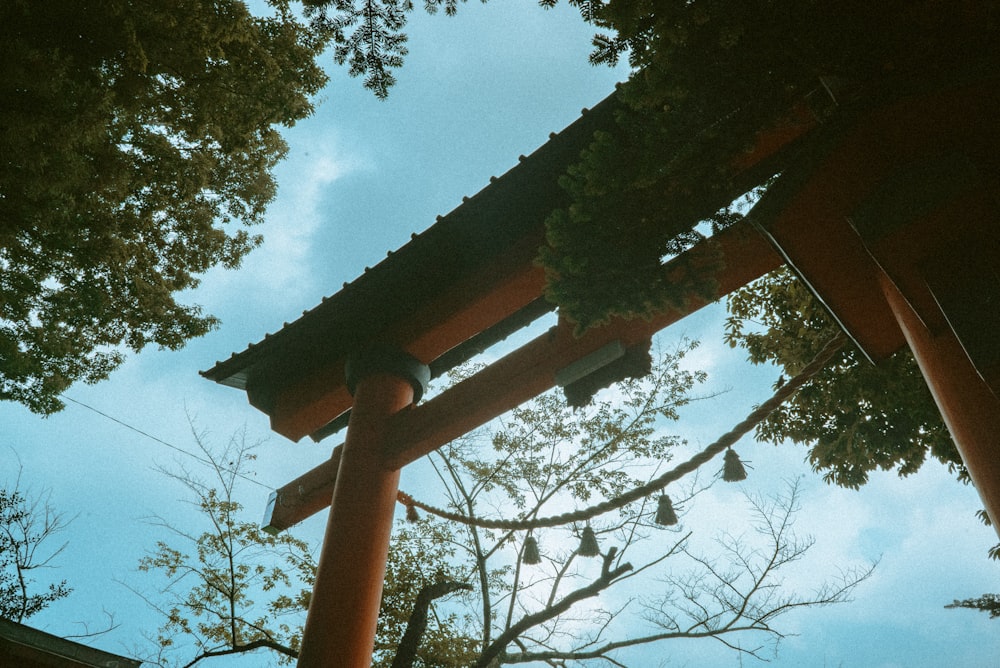 a tall wooden structure sitting under a blue sky