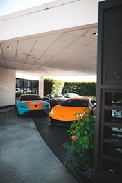 four sports cars in assorted colors