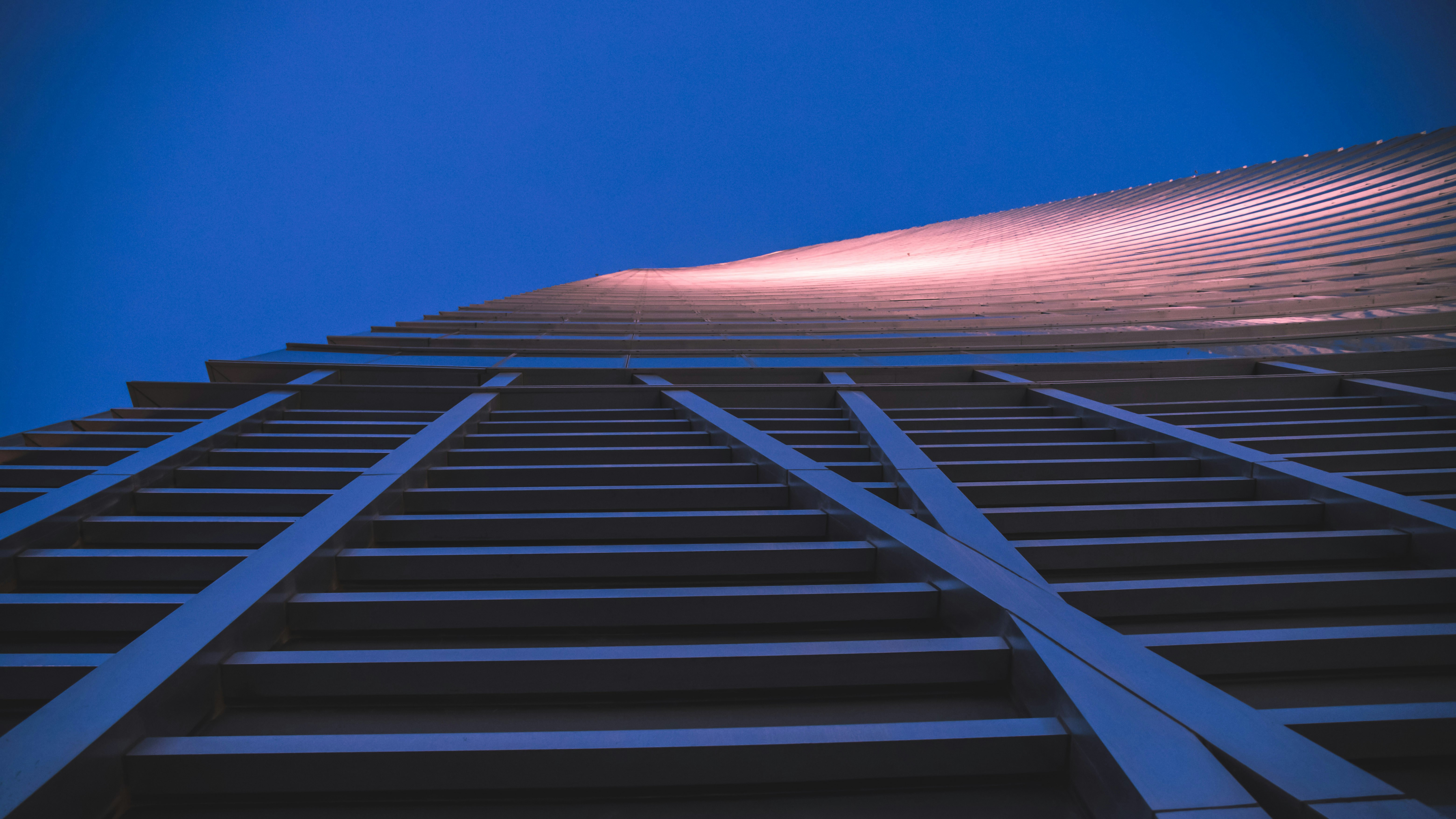 a tall building with a blue sky in the background