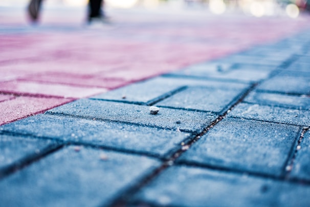 Close-up of vibrant blue, red, white, and black floor tiles.