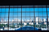 Large glass window panel showcasing clear view of cityscape.
