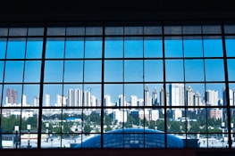 A close-up of a sparkling clean window with a cityscape in the background.