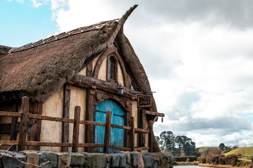 brown and beige house with blue door