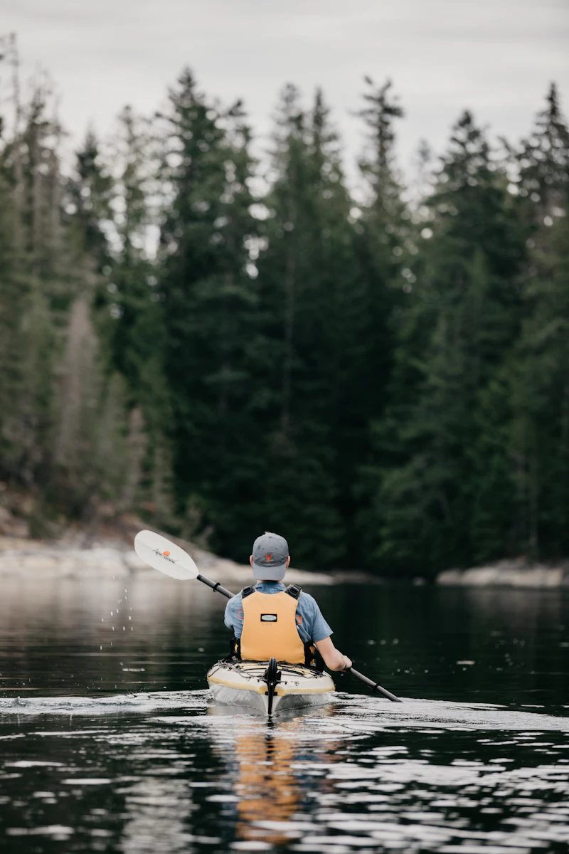 Person sitting in a kayak in bright daylight