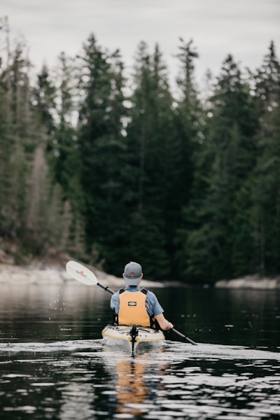 Kayaking on calm lake water