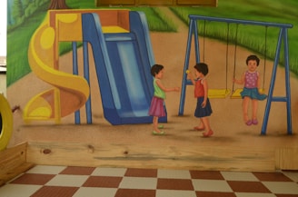Children collaborating on a colorful mural in a park.