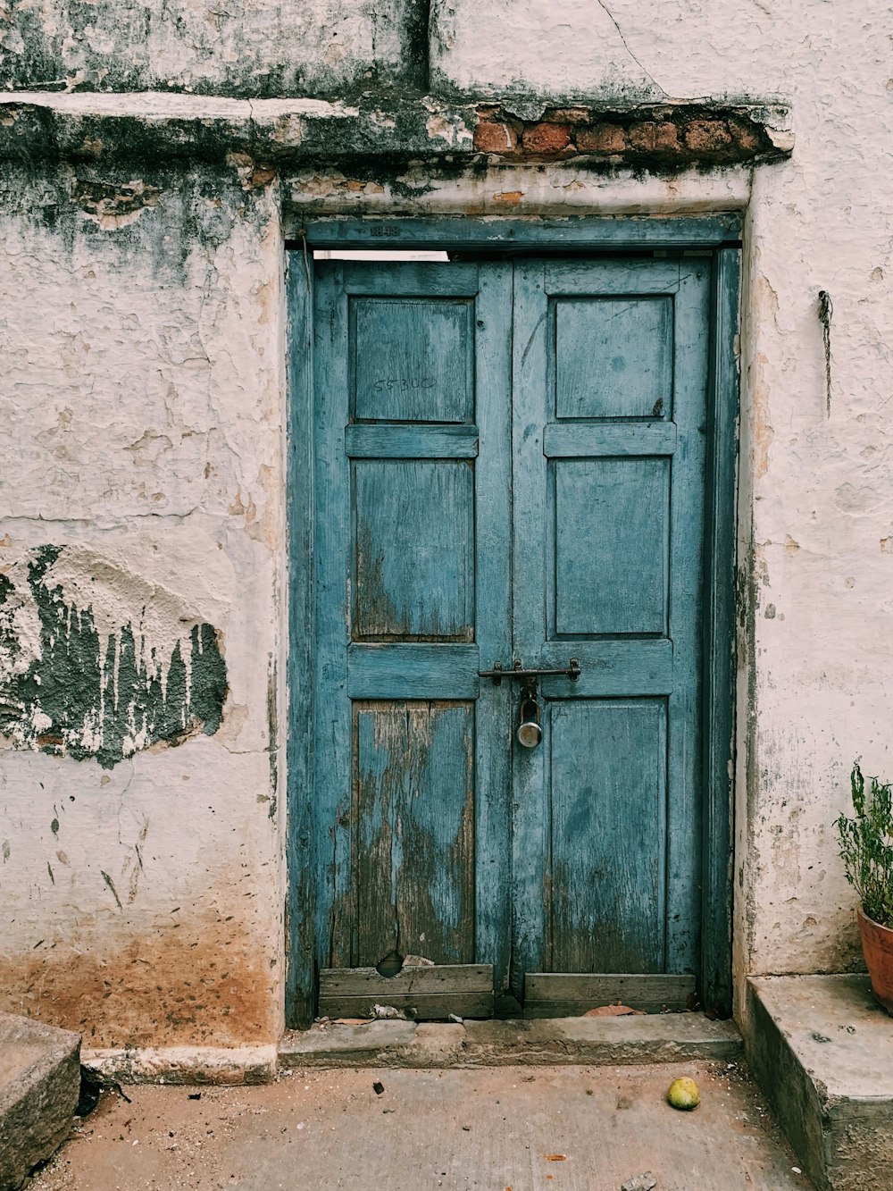 blue wooden 6-paneled door