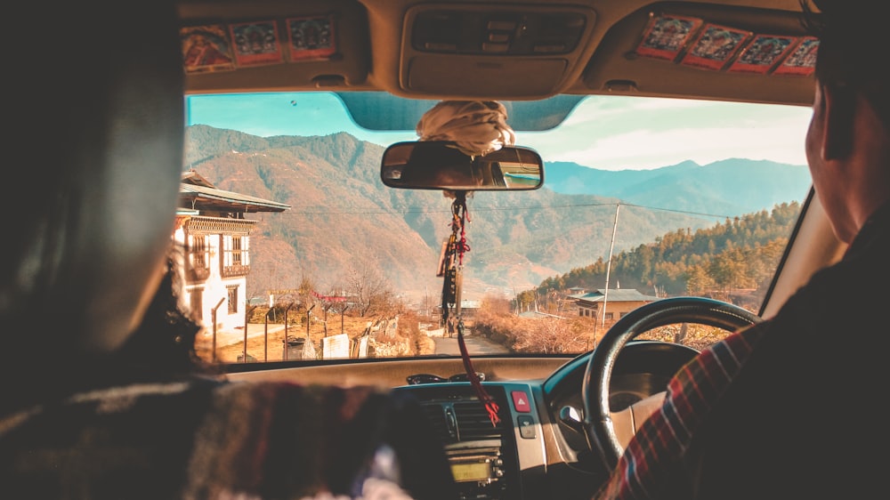 two men sitting inside car