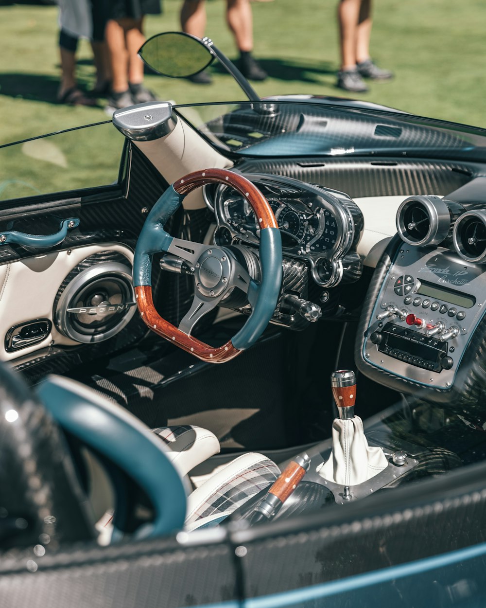 gray, brown and green interior of a convertible sports car