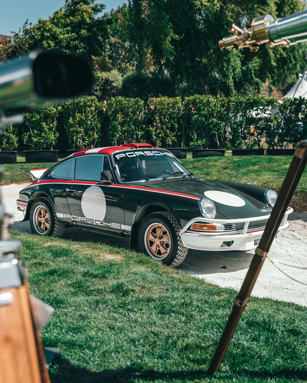 black, white and red Porsche coupe