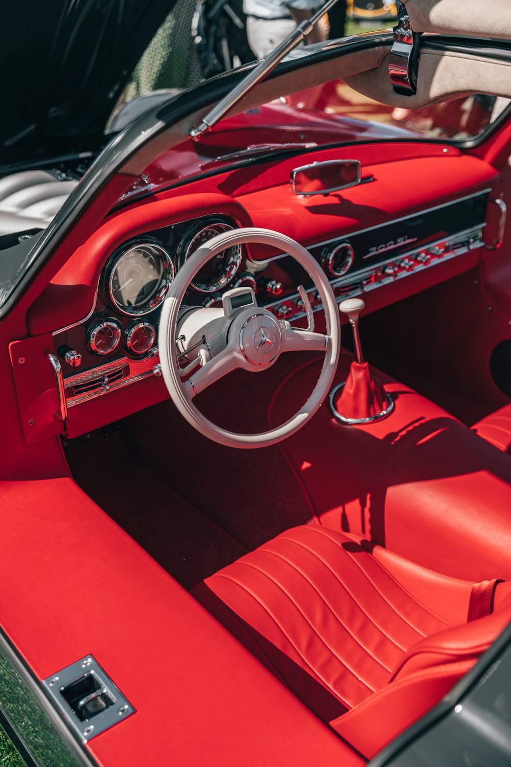 black, red and white interior of a sports car